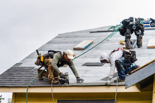 Professional Roofing technician working in Water Mill, NY